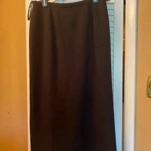 KASPER black A-line skirt with a long split in the back.